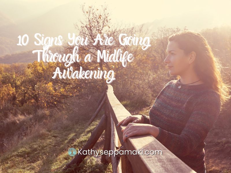 10 Signs You Are Going Through a Midlife Awakening blog post. Picture of a woman standing at a railing and looking off into the distance