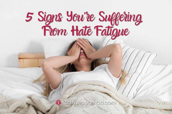 5 Signs You're Suffering from Hate Fatigue blog post with picture of woman laying in bed with her hands over her face looking distressed