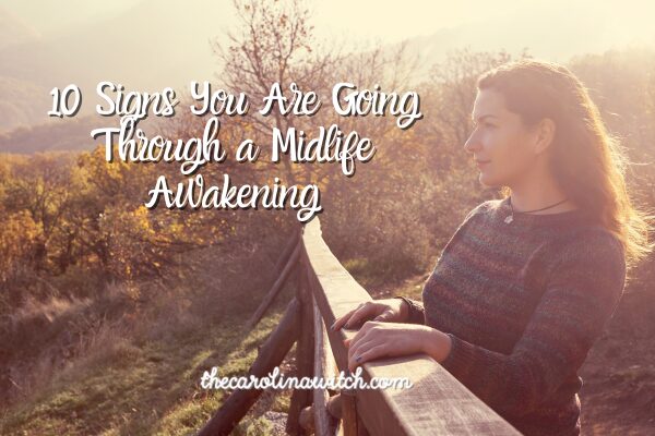 10 Signs You Are Going Through a Midlife Awakening blog post. Picture of a woman standing at a railing and looking off into the distance